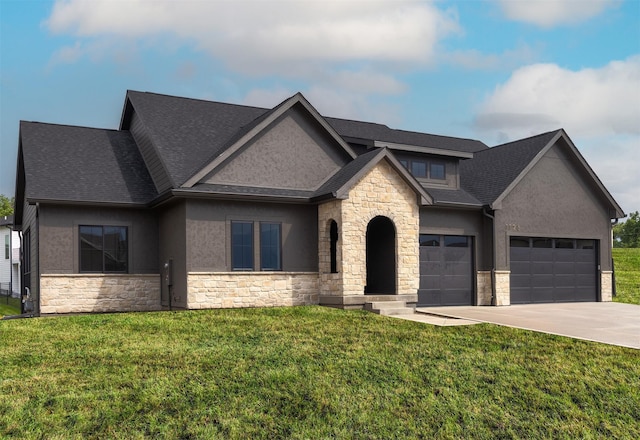 1128 NW 29th Ct, Grimes, IA 50111 - view of front of house with stone siding, stucco siding, concrete driveway, a garage, and a front yard