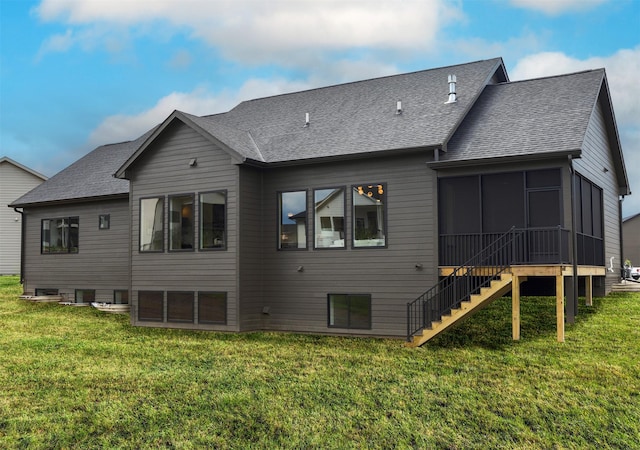 1128 NW 29th Ct, Grimes, IA 50111 - back of property featuring a sunroom, stairway, a shingled roof, and a lawn