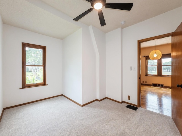 324 9th St, West Des Moines, IA 50265 - empty room featuring light colored carpet, a ceiling fan, and a smoke detector