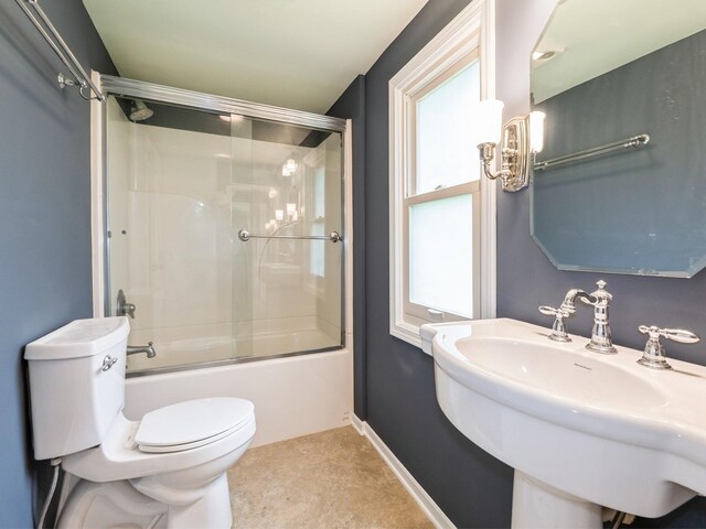 324 9th St, West Des Moines, IA 50265 - full bathroom with toilet and combined bath / shower with glass door