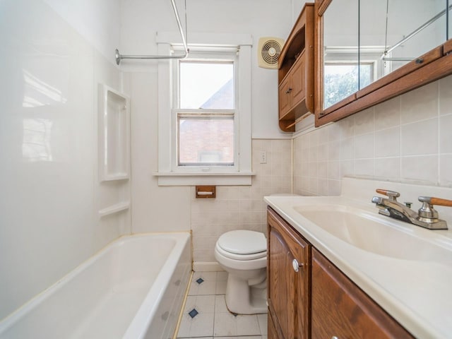 2928 34th St, Des Moines, IA 50310 - full bath with tile patterned floors, vanity, shower / bathtub combination, and tile walls