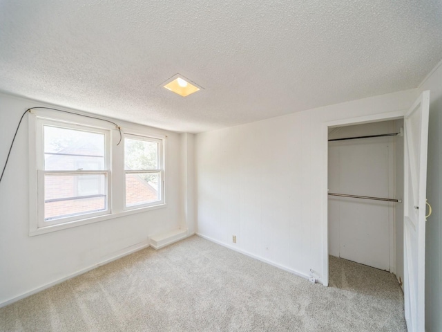 2928 34th St, Des Moines, IA 50310 - unfurnished bedroom with carpet and a textured ceiling