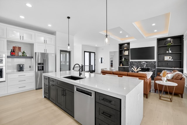 1305 NW 28th St, Grimes, IA 50111 - kitchen featuring stainless steel appliances, light wood-style floors, white cabinets, recessed lighting, and open shelves