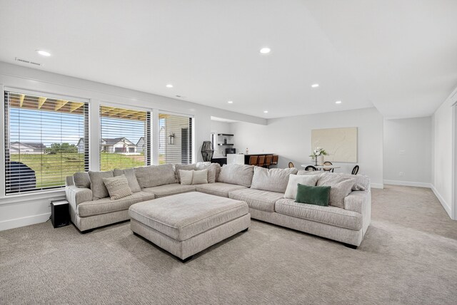 1305 NW 28th St, Grimes, IA 50111 - living area featuring light carpet and recessed lighting