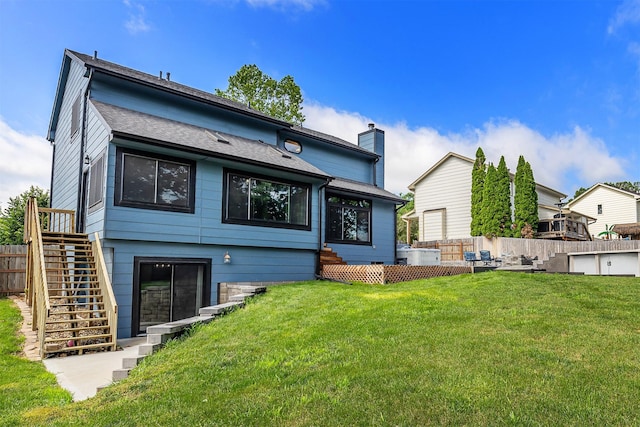 3170 E Kenyon Ave, Des Moines, IA 50320 - rear view of property featuring stairs and a chimney