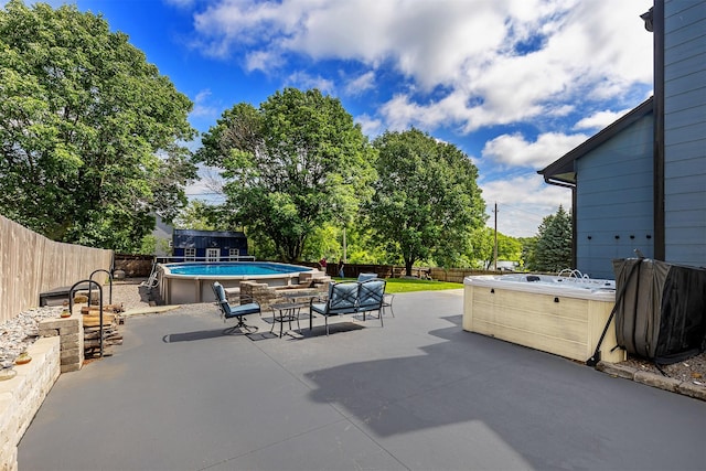 3170 E Kenyon Ave, Des Moines, IA 50320 - fenced backyard featuring a hot tub and a patio