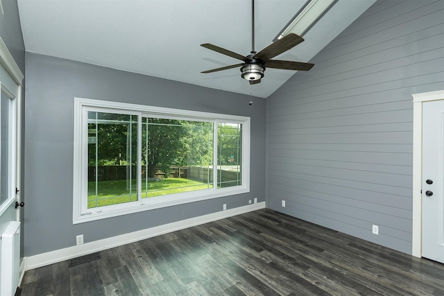 3170 E Kenyon Ave, Des Moines, IA 50320 - unfurnished room with lofted ceiling, a ceiling fan, dark wood-style floors, and wooden walls