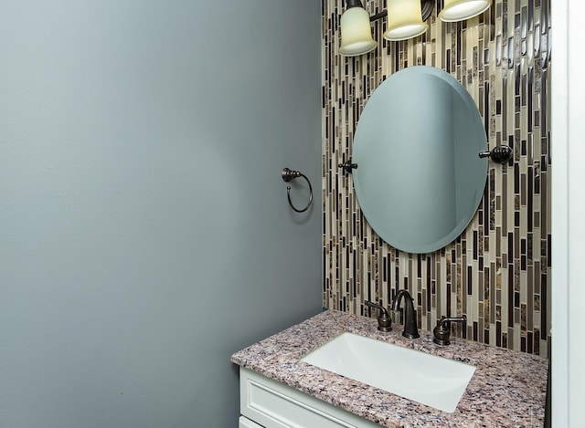 3170 E Kenyon Ave, Des Moines, IA 50320 - bathroom featuring vanity and backsplash