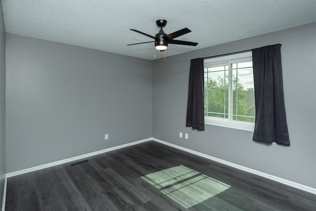 3170 E Kenyon Ave, Des Moines, IA 50320 - spare room featuring dark wood finished floors, a textured ceiling, and ceiling fan