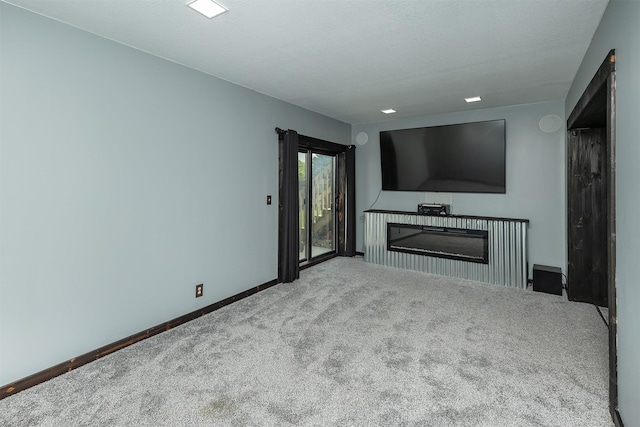 3170 E Kenyon Ave, Des Moines, IA 50320 - unfurnished living room featuring carpet floors and baseboards