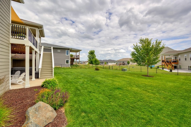 9824 Dunmore Cir, Johnston, IA 50131 - fenced backyard featuring stairway, a patio, a residential view, and a deck