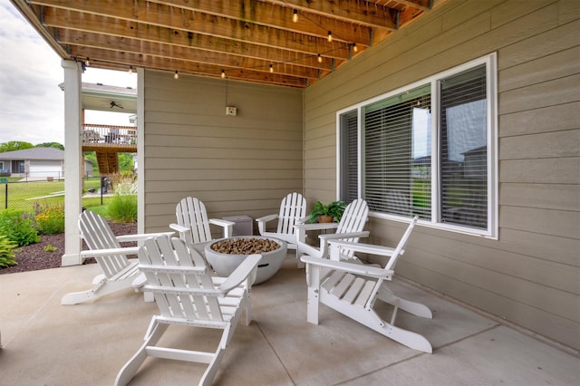 9824 Dunmore Cir, Johnston, IA 50131 - view of patio / terrace featuring an outdoor fire pit