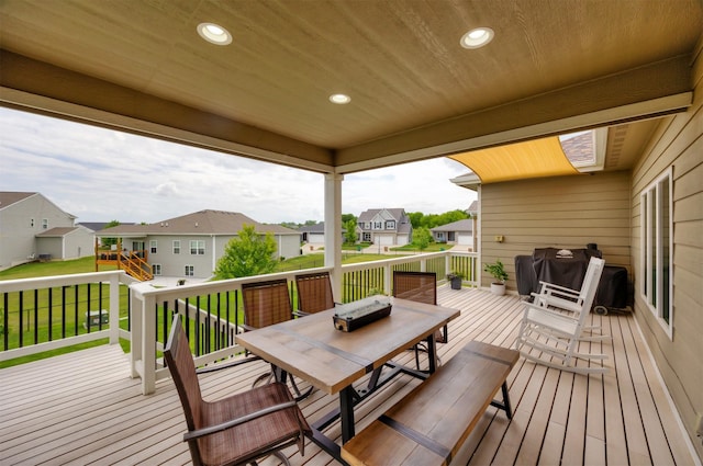 9824 Dunmore Cir, Johnston, IA 50131 - wooden terrace featuring a residential view, outdoor dining area, and a lawn