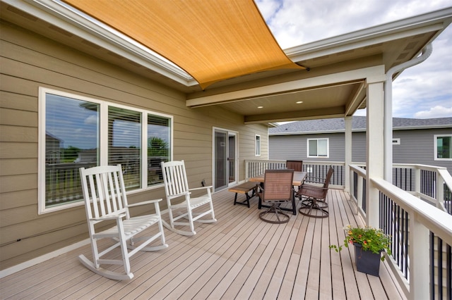 9824 Dunmore Cir, Johnston, IA 50131 - wooden terrace with outdoor dining space