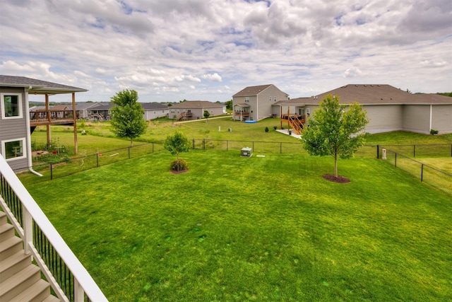 9824 Dunmore Cir, Johnston, IA 50131 - fenced backyard with a residential view and a deck