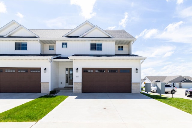 720 Spruce St NW, Bondurant, IA 50035 - view of front facade featuring an attached garage and driveway