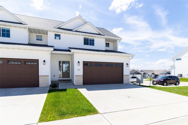 720 Spruce St NW, Bondurant, IA 50035 - modern inspired farmhouse featuring driveway, an attached garage, and board and batten siding