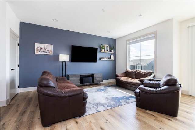 720 Spruce St NW, Bondurant, IA 50035 - living room featuring light wood-style floors and recessed lighting