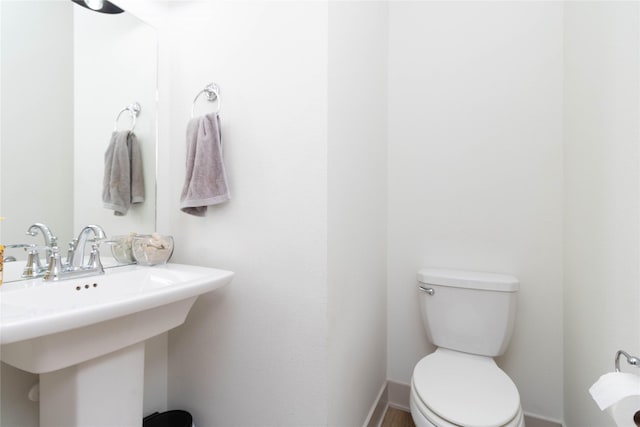 720 Spruce St NW, Bondurant, IA 50035 - bathroom featuring toilet and a sink