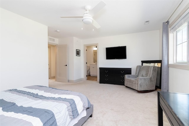 720 Spruce St NW, Bondurant, IA 50035 - bedroom with light colored carpet, a ceiling fan, and ensuite bathroom