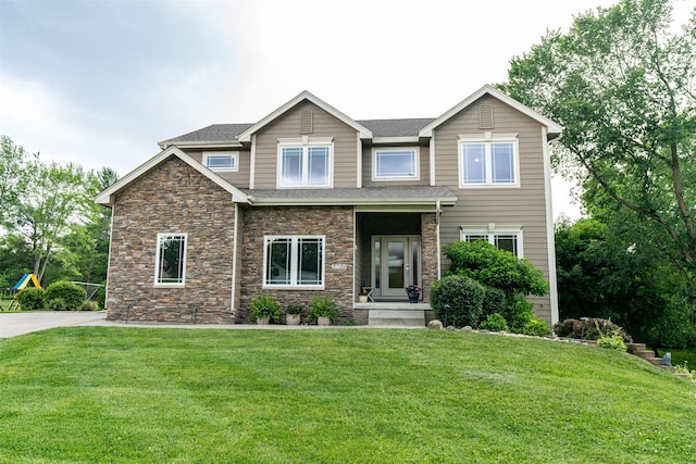 2726 SE 11th St, West Des Moines, IA 50265 - view of front of house featuring stone siding and a front lawn