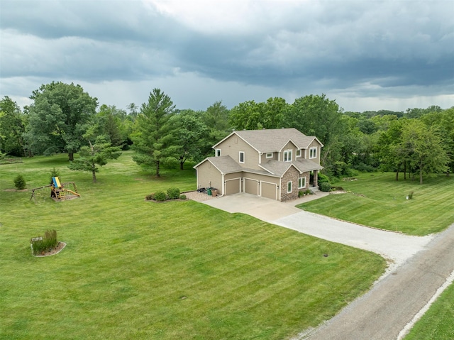2726 SE 11th St, West Des Moines, IA 50265 - view of front of property with a garage, concrete driveway, a front yard, and a playground
