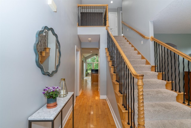 2726 SE 11th St, West Des Moines, IA 50265 - stairs with hardwood / wood-style flooring and recessed lighting