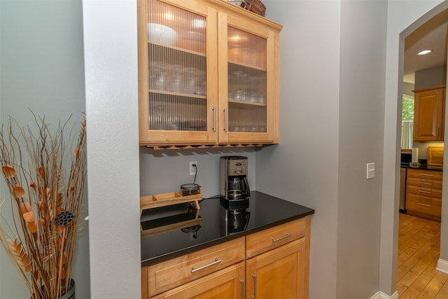2726 SE 11th St, West Des Moines, IA 50265 - bar with arched walkways, light wood-type flooring, and recessed lighting
