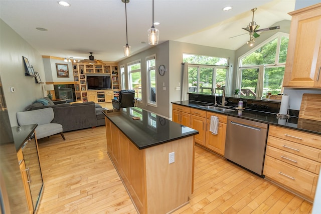 2726 SE 11th St, West Des Moines, IA 50265 - kitchen featuring dishwasher, ceiling fan, light wood-style flooring, a glass covered fireplace, and recessed lighting