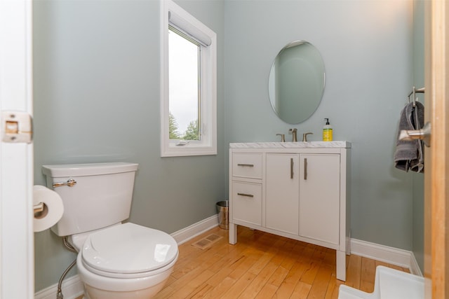 2726 SE 11th St, West Des Moines, IA 50265 - bathroom with vanity and hardwood / wood-style floors