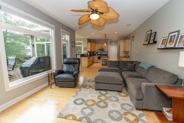 2726 SE 11th St, West Des Moines, IA 50265 - living area featuring light wood-style floors and ceiling fan