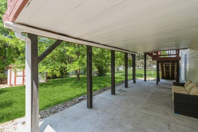 4965 Raintree Dr, West Des Moines, IA 50265 - view of patio featuring a storage unit