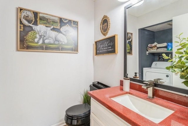 4965 Raintree Dr, West Des Moines, IA 50265 - bathroom featuring washer / clothes dryer and vanity