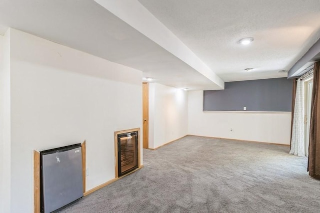4965 Raintree Dr, West Des Moines, IA 50265 - finished below grade area featuring refrigerator, carpet, and a textured ceiling