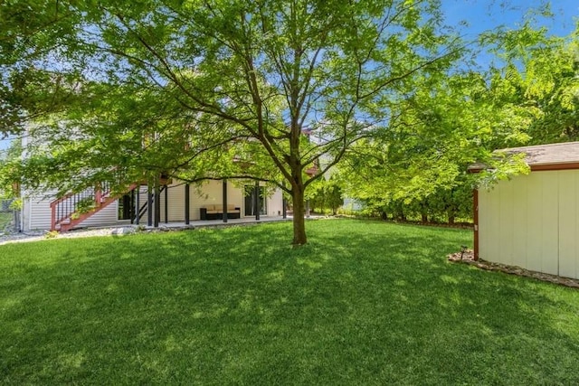 4965 Raintree Dr, West Des Moines, IA 50265 - view of grassy yard featuring a shed