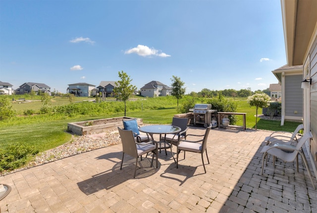 17475 Baxter Dr, Clive, IA 50325 - view of patio with a grill, outdoor dining area, and a residential view