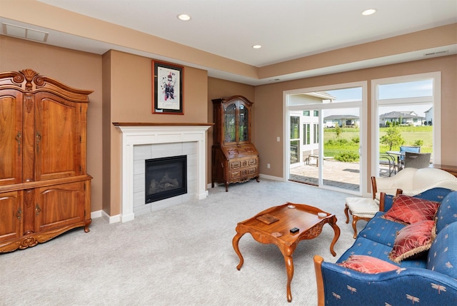 17475 Baxter Dr, Clive, IA 50325 - living area featuring light carpet, a tile fireplace, and recessed lighting