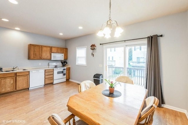 4528 NE Mcdougal Ln, Ankeny, IA 50021 - dining space featuring light wood finished floors, recessed lighting, and a chandelier