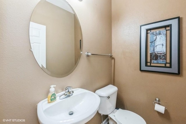 4528 NE Mcdougal Ln, Ankeny, IA 50021 - half bathroom featuring a sink and toilet