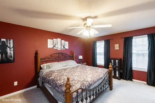 4528 NE Mcdougal Ln, Ankeny, IA 50021 - bedroom featuring light colored carpet and a ceiling fan