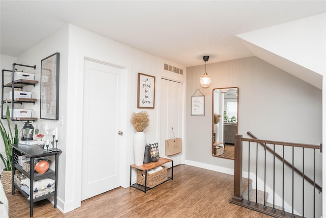 2714 NW Lois Ln, Ankeny, IA 50023 - hall featuring wood finished floors and an upstairs landing