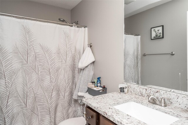 2714 NW Lois Ln, Ankeny, IA 50023 - bathroom featuring vanity and a shower with shower curtain