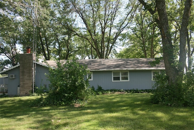 13018 137th Ave, Plano, IA 52581 - view of front facade with a chimney and a front lawn
