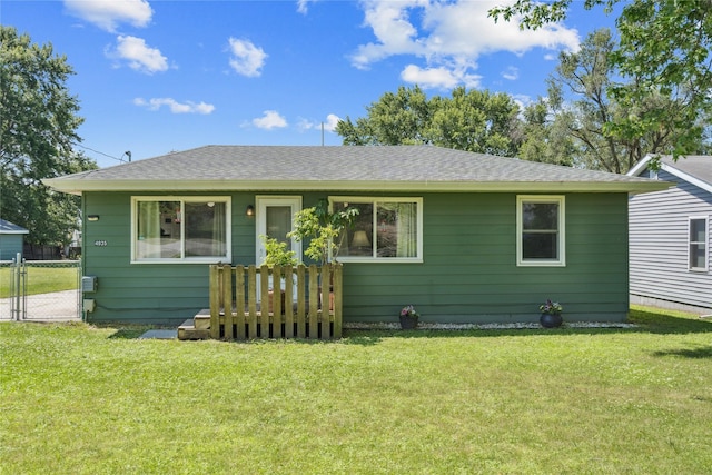 4935 NE 39th Ave, Des Moines, IA 50317 - view of front facade with a gate, a front yard, and roof with shingles