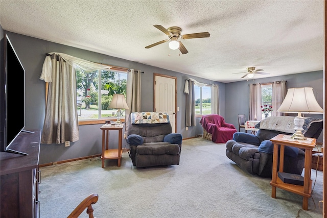 4935 NE 39th Ave, Des Moines, IA 50317 - carpeted living room with ceiling fan and a textured ceiling