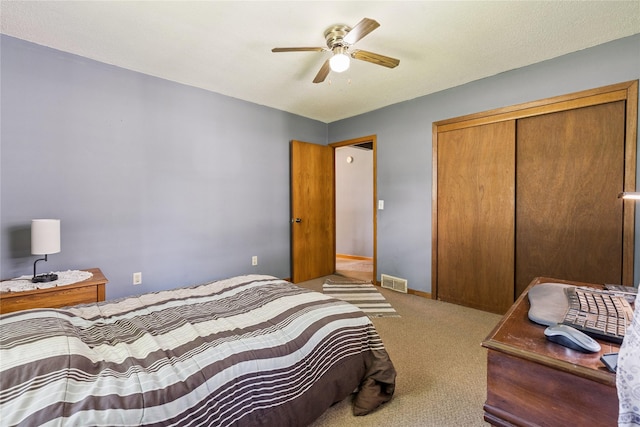4935 NE 39th Ave, Des Moines, IA 50317 - bedroom with carpet floors, a closet, and ceiling fan