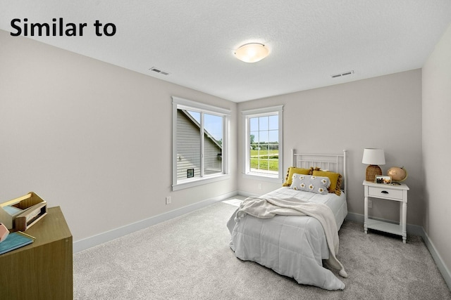 1156 NW 31st St, Grimes, IA 50111 - carpeted bedroom with baseboards and a textured ceiling