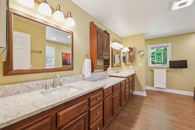 4416 Oakwood Ln, West Des Moines, IA 50265 - full bathroom with wood finished floors, double vanity, and plenty of natural light