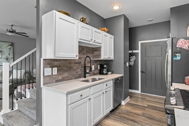 2817 NW Lois Ln, Ankeny, IA 50023 - kitchen with ceiling fan, appliances with stainless steel finishes, decorative backsplash, light countertops, and white cabinets