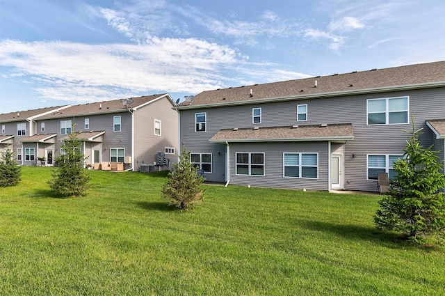2817 NW Lois Ln, Ankeny, IA 50023 - rear view of house featuring a lawn and a residential view